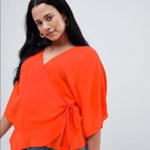Orange kimono sleeve wrap top